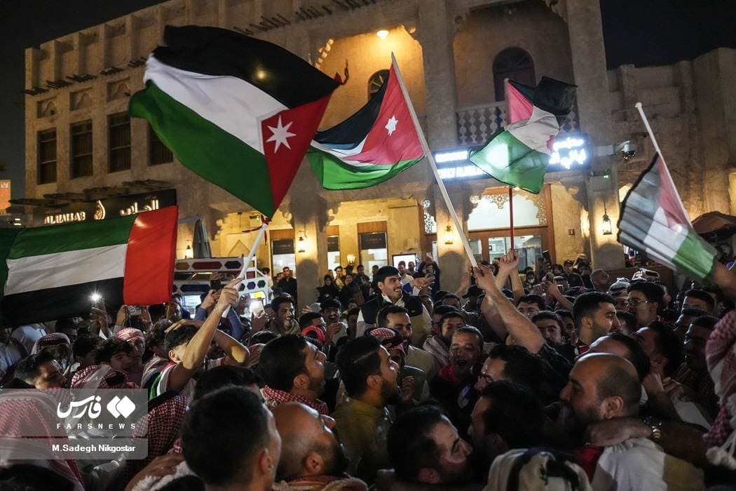 Fans with Palestinian flags in Doha during the Asian Cup