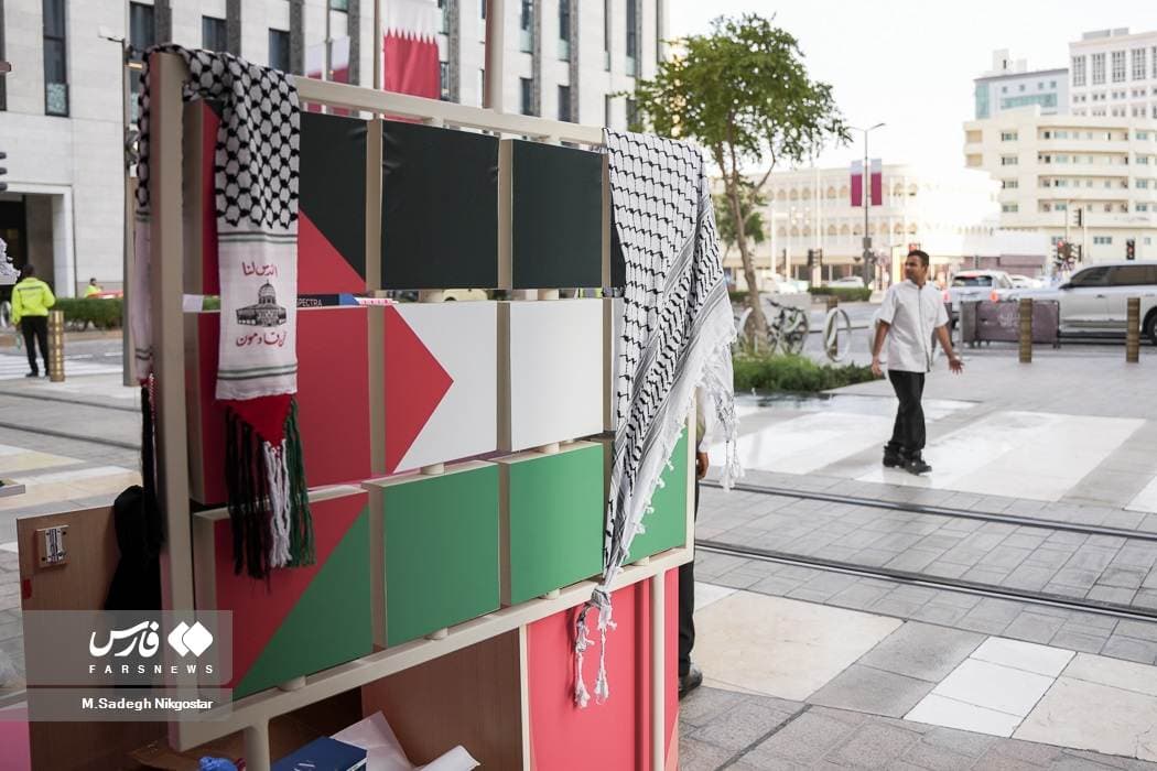 Palestinian flags and keffiyehs on display in Doha