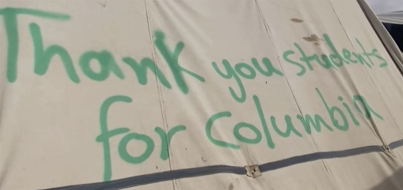“Thank you students for Columbia”, painted on a tent in Rafah, 2024